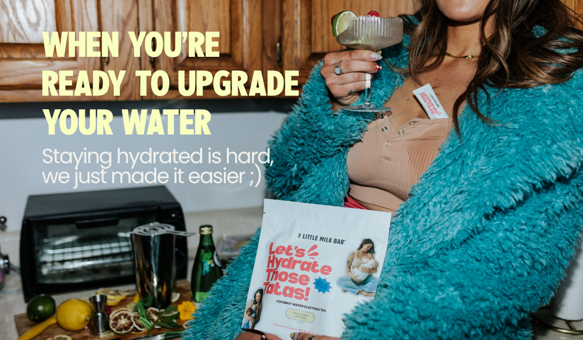 Mom holding a bag of Let's Hydrate Those Tatas coconut water electrolytes and a shaker bottle, an easy way to upgrade your water while breastfeeding