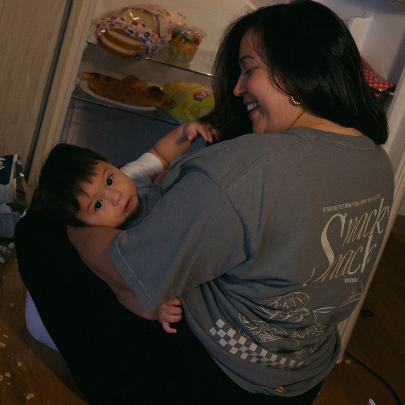[main] A mom wearing a grey T-shirt with the phrase 