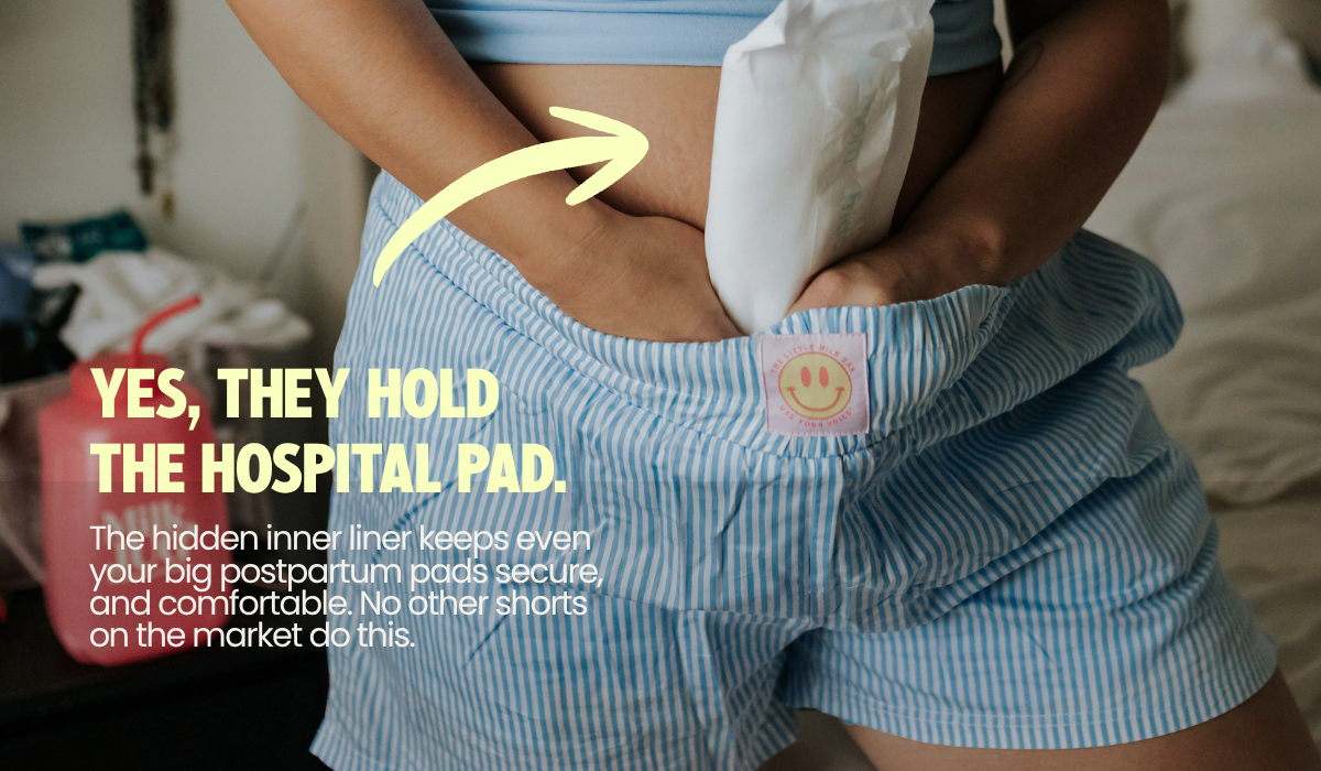 Mom tucking a hospital postpartum pad into the hidden inner liner of the Postpartum Boxer Shorts, which holds even large pads securely with no underwear needed
